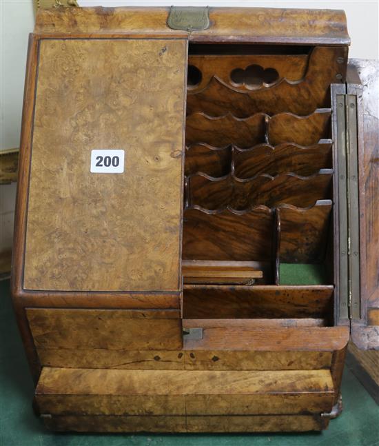 A walnut stationery cabinet